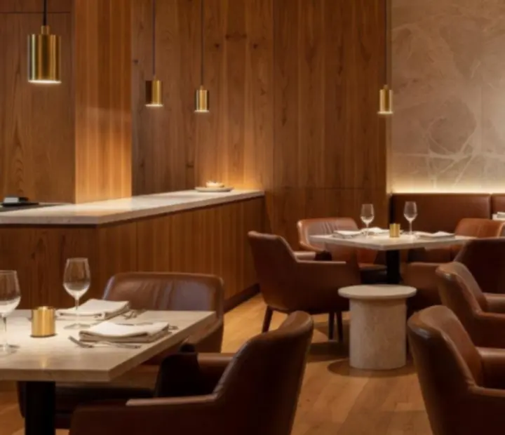 NAXSOL ENTERPRISES LTD dining room with timber, stone and brushed brass accents